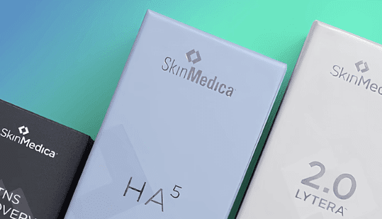 A close-up view of three different packaging designs for SkinMedica