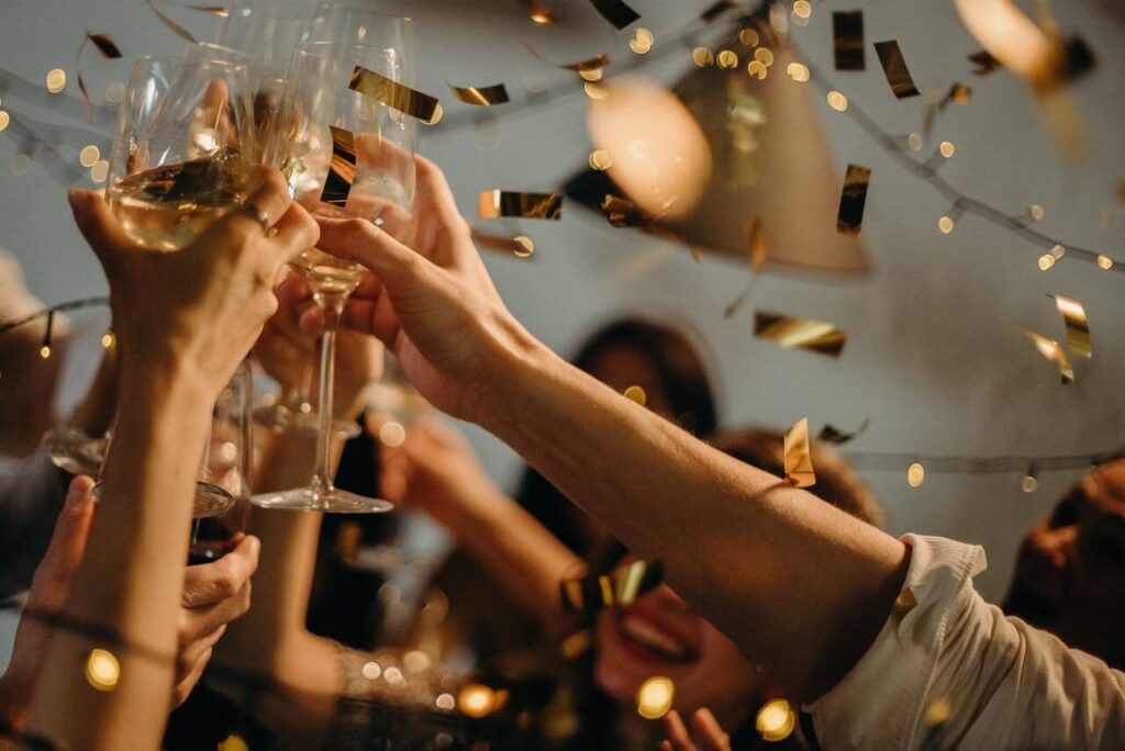 A group of people toasting at a celebratory event