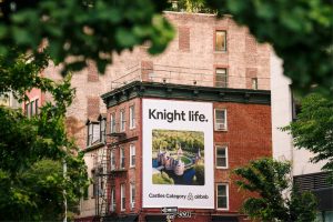 Airbnb Ad on brick building.