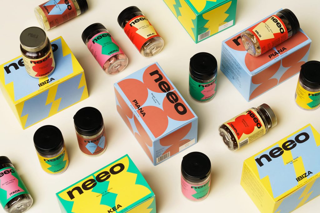 Colorful bright Neeo skincare packaging flatlay on table.