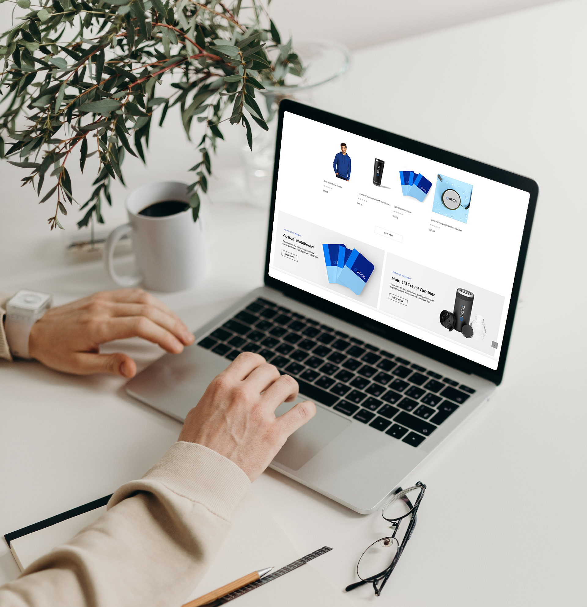 Person navigating the Sticki company store on a table.