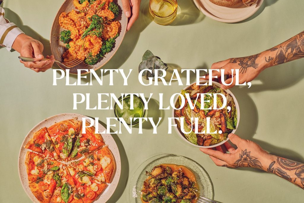 Cafe Gratitude's Facebook banner showcases their food photography and typography.