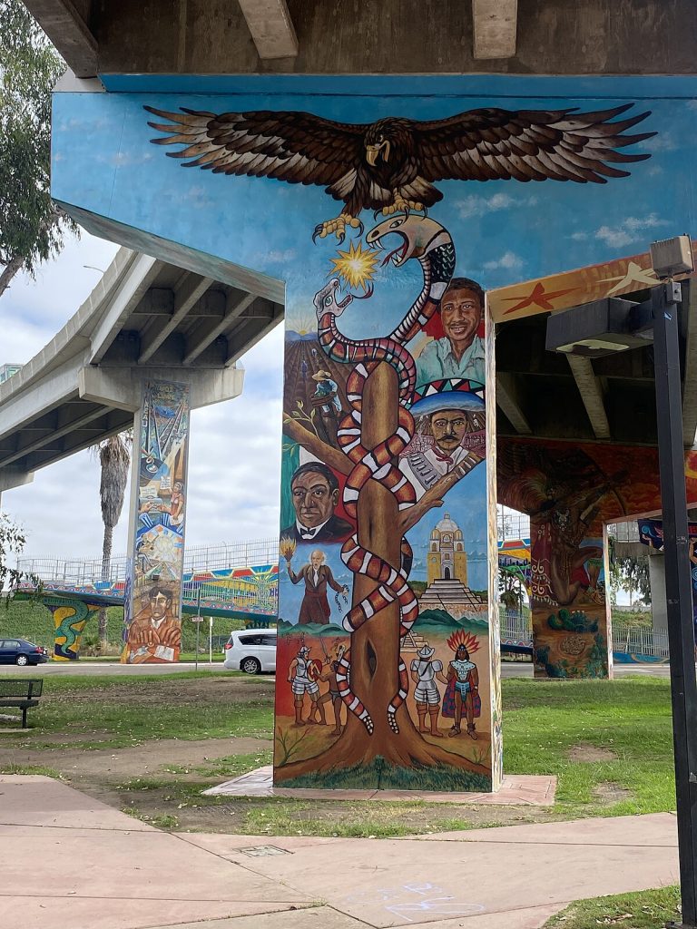 Mural featuring people and animals in San Diego's Chicano Park. 