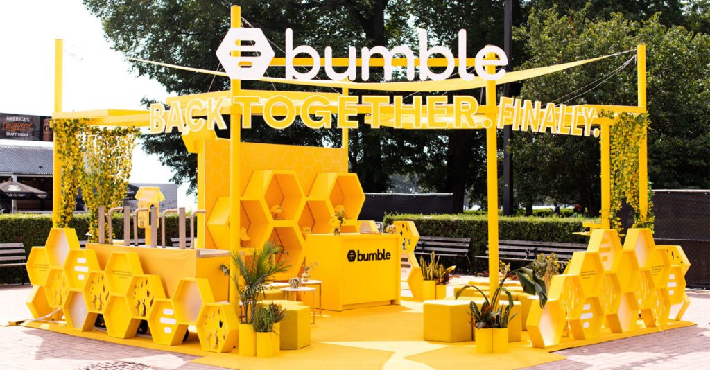 Bumble promotional booth outdoor featuring Bumble's branding.  